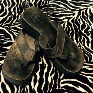 Reef black leather flip flops