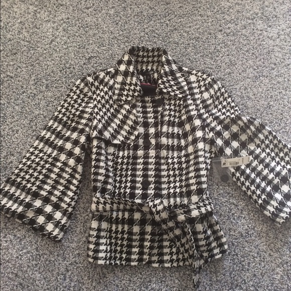 Black and white brand new over coat.