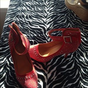 Red studded silver high heels