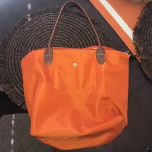 Orange longchamp purse