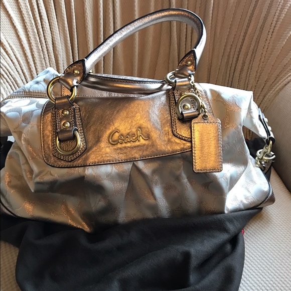 Metallic coach signature purse