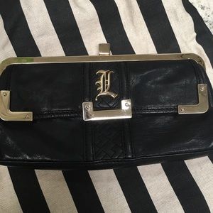 L.A.M.B leather black & gold clutch