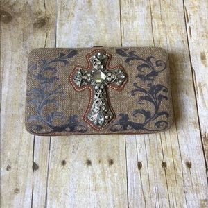 Pocket book with cross embellishment