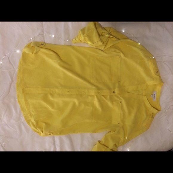 Yellow Calvin Klein top.