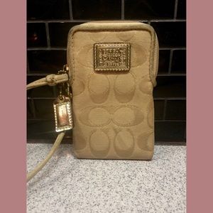 COACH gold universal wristlet • ✨