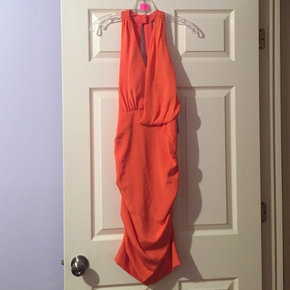 Orange bodycon Nicole Miller with back opening.
