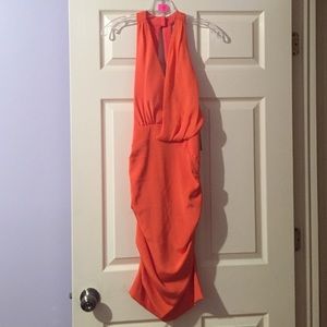 Orange bodycon Nicole Miller with back opening.
