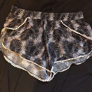 Palm leaf printed dolphin shorts