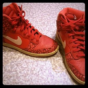 Nike red hightop shoes.
