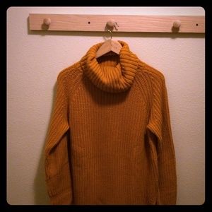 Long tunic length turtleneck sweater