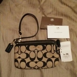 Brand new never used Coach wristlet