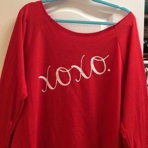 Cute xoxo top that can be worn off the shoulder.