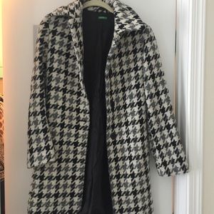 Houndstooth coat with black silk lining.