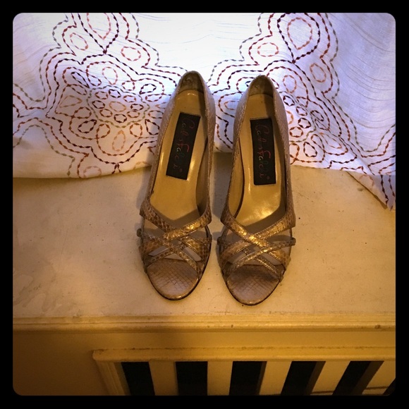Gold peep toe pumps.