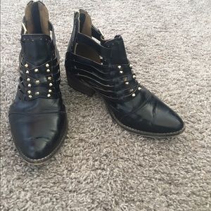 Leather black booties brand is "Matisse"