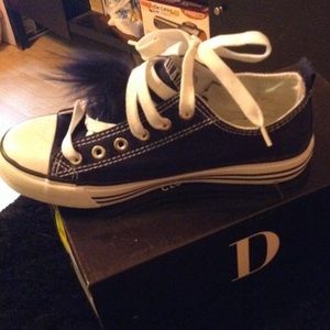 Navy Blue Converse With A Fur Ball On The Tongue.