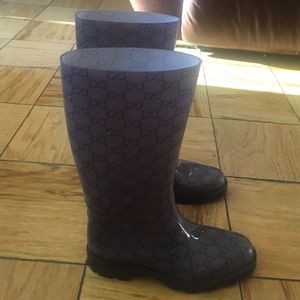Used Gucci rain boots with minor stain