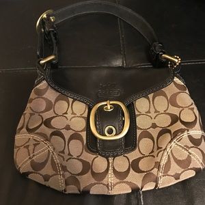 Tan Coach purse, small.