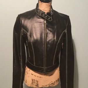 Black leather jacket with white stitch detail.