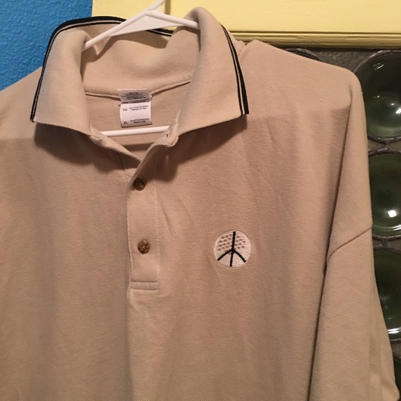 NWOT MEN'S GOLF SHIRT WITH PEACE BALL LOGO