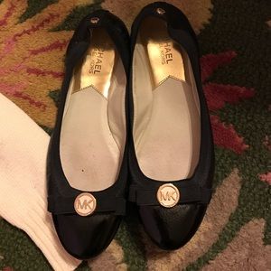 Black leather MK flats with bow detail