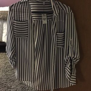 Striped shirt with tags on it from express