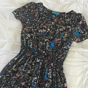 Fun patterned dress with button detail on back.