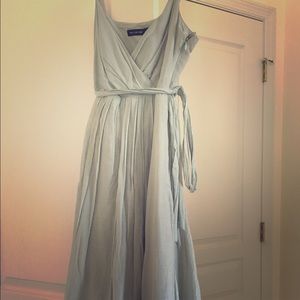 Airy mint linen dress with gold trim detail.