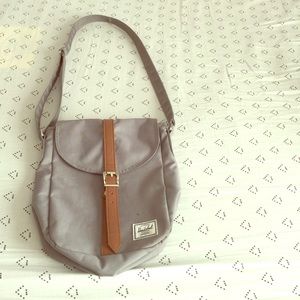 Grey Herschel cross body bag.
