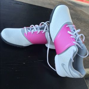 White pink and black Nike golf shoes