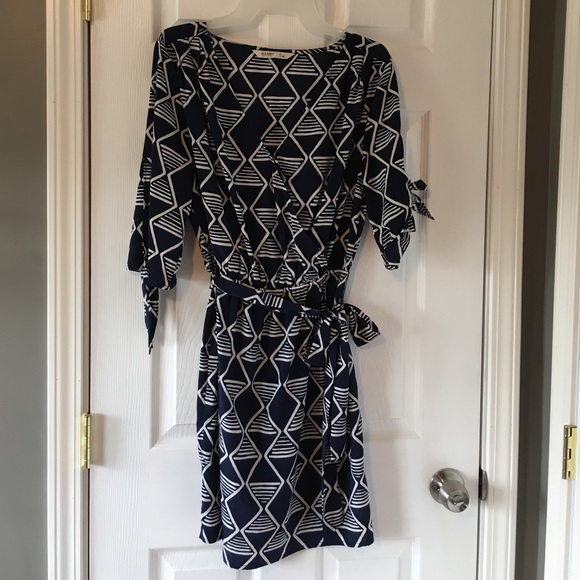 Shirt dress with ties on sleeves & sash at waist.