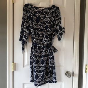 Shirt dress with ties on sleeves & sash at waist.