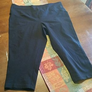 3 pairs pairs of black workout pants.