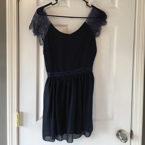 Mini dress with lace cap sleeves and deep-v back