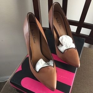 Brown pumps with purple piping accents