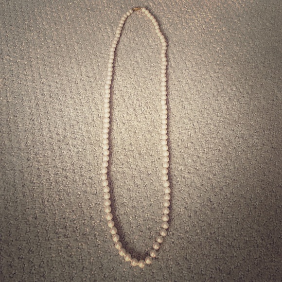 Long string of pearls with extra security clasp