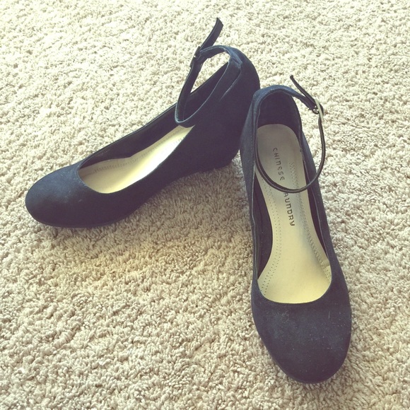Black suede wedge with ankle strap.