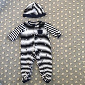 One piece snap on footie with hat