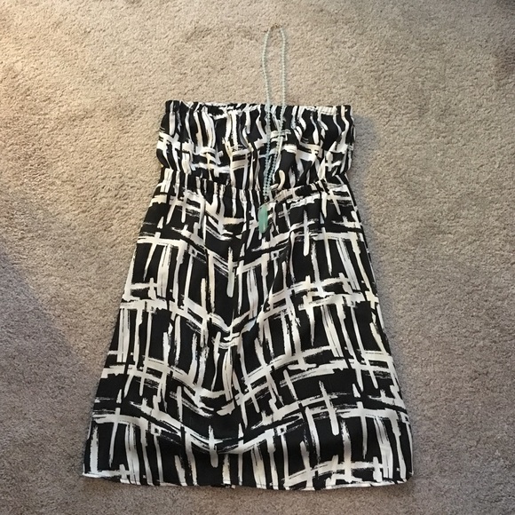 Black and white strapless dress.