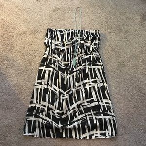 Black and white strapless dress.