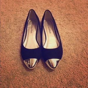 Black flats with silver tips