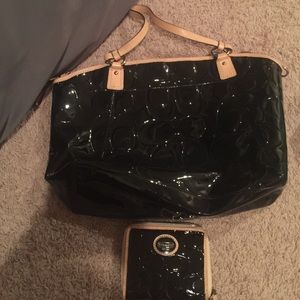 A black and peach purse and wallet