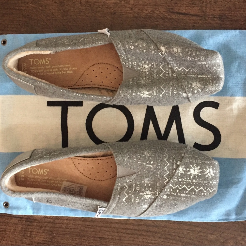 Brand new TOMS silver Aztec print flats