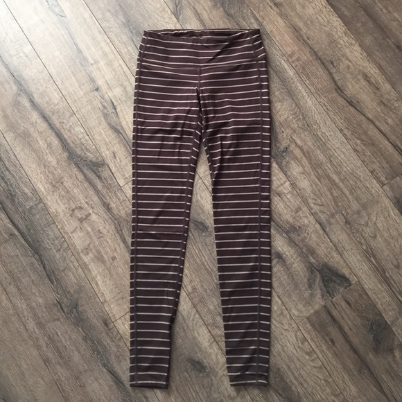 Athlete small tall brown and cream stripes tights.