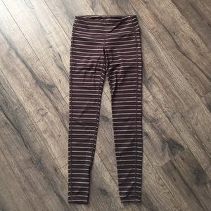 Athlete small tall brown and cream stripes tights.