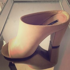 Peep toe Nude Colored Mules.
