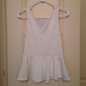 White peplum top with a Deep V back