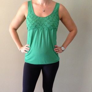 Cute green tank top. 95% rayon 5% spandex