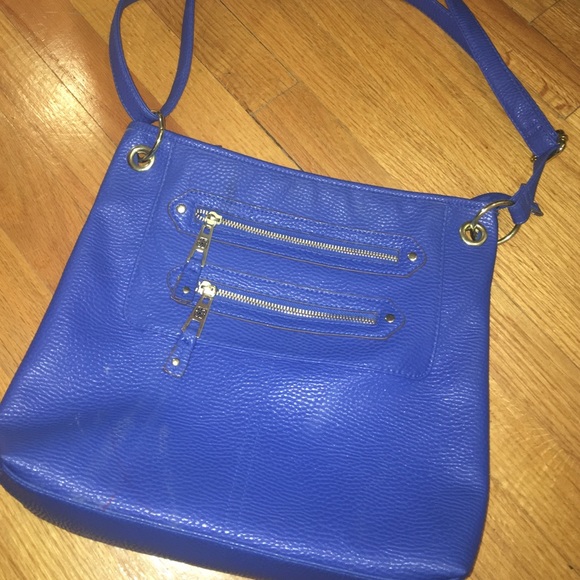 big blue bag with zippers