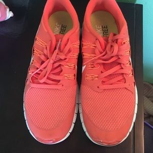 Orange Nike free sneakers